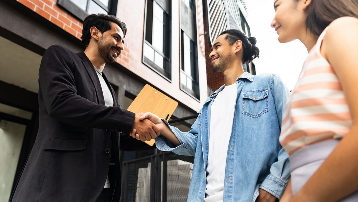 image showing a Mack Property employee explaining our Property Management options